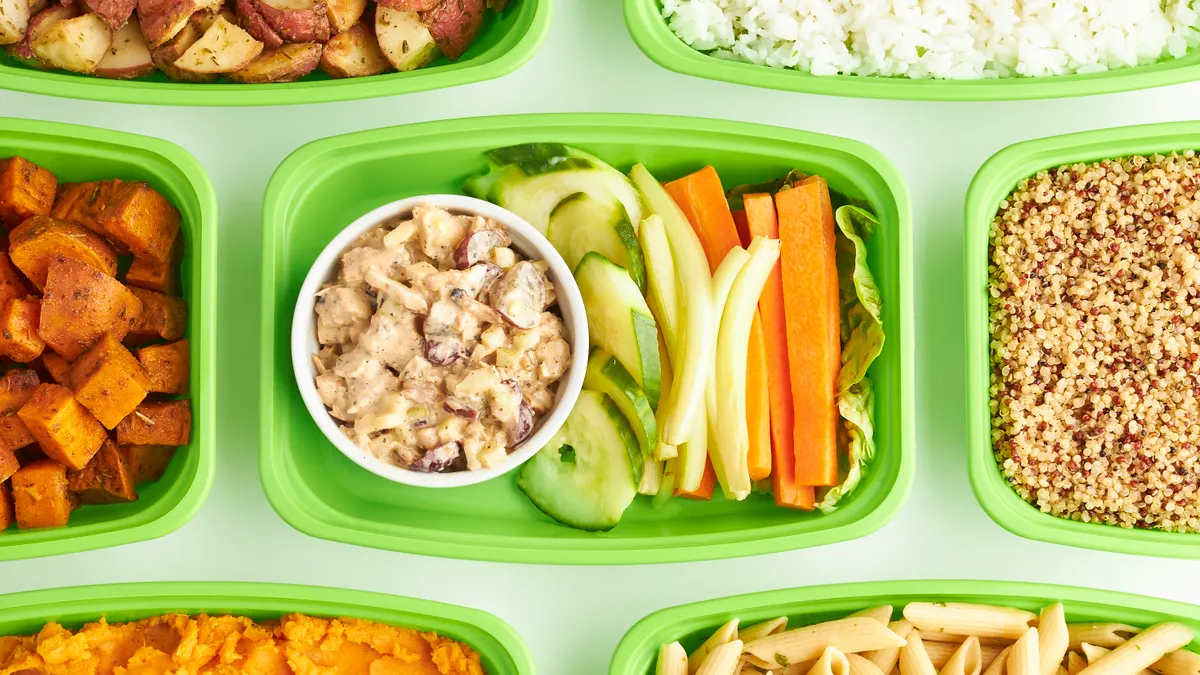 Meal-prep containers with balanced portions of vegetables and grains