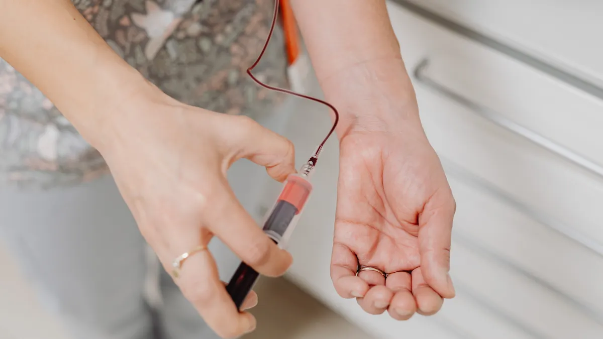 Gestational Diabetes Screening Results: What a Failed Glucose Test Means Blood sample taken from an arm