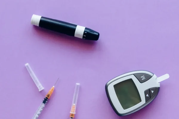 Insulin for Gestational Diabetes: When It Is Needed — Diabetic Kit and Insulin over a Purple Surface