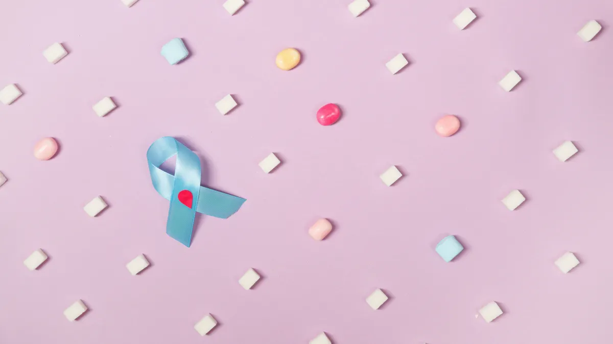 Social Support Systems and Gestational Diabetes Social Support Systems and Gestational Diabetes — Candies On Pink Background With Blue Diabetes Awareness Ribbon