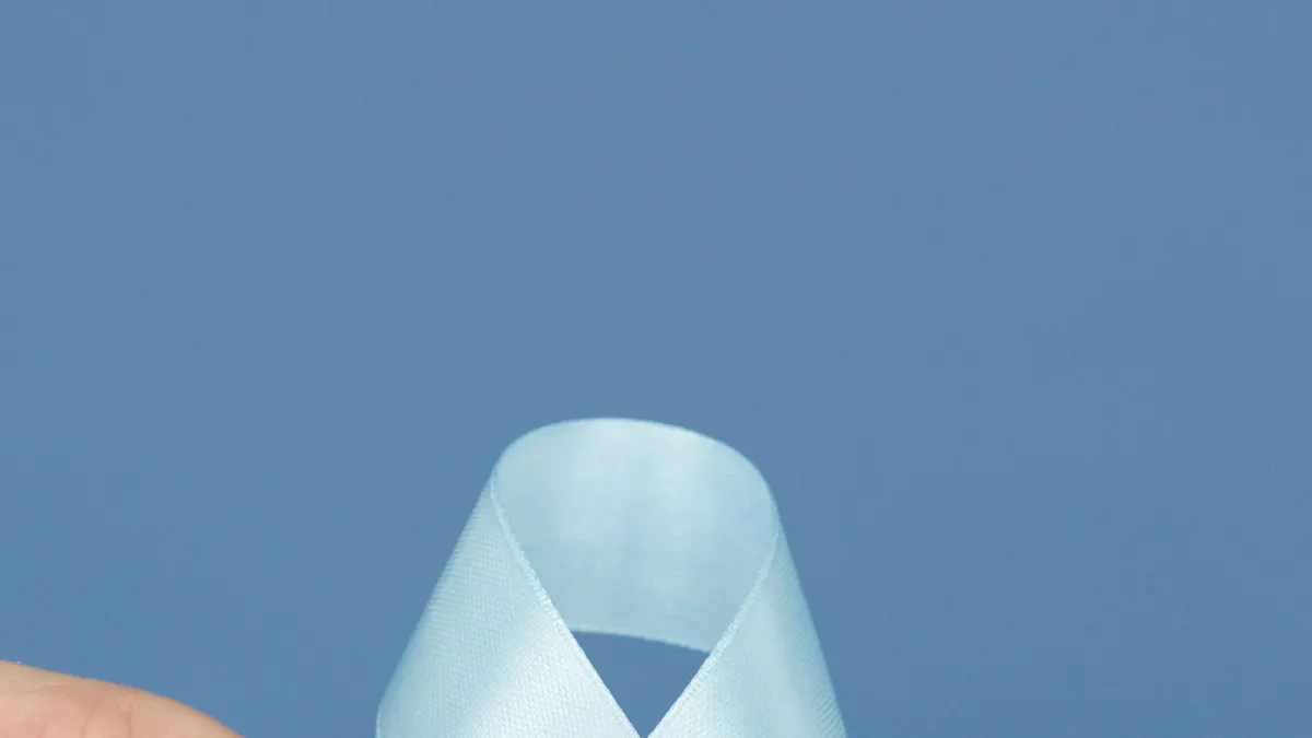 Social Support Systems and Gestational Diabetes — Person Holding A White Diabetes Awareness Ribbon With Decorated Blood